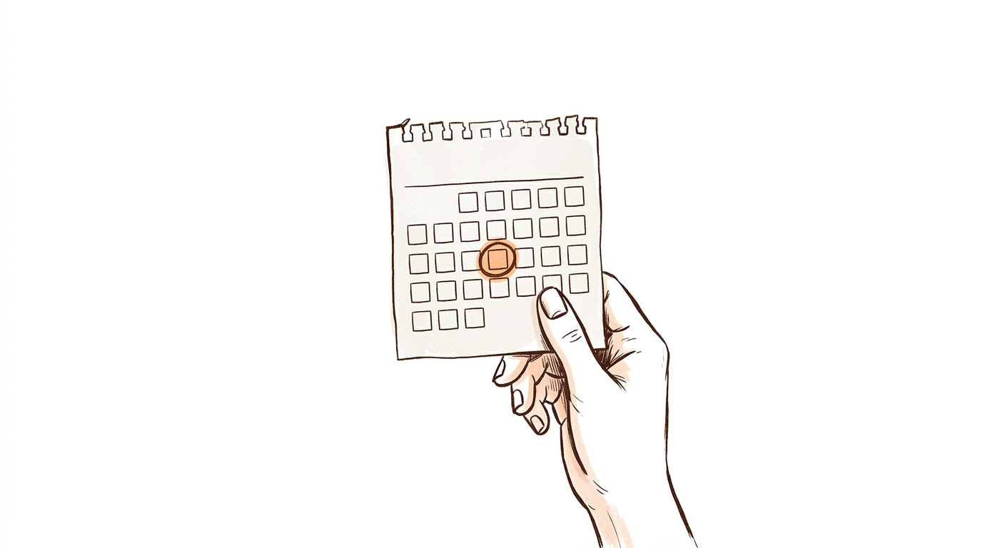 A hand holding a calendar page with one day circled